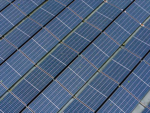 Aerial view of wet solar roof panels covered with rainwater in Riga, Latvia.