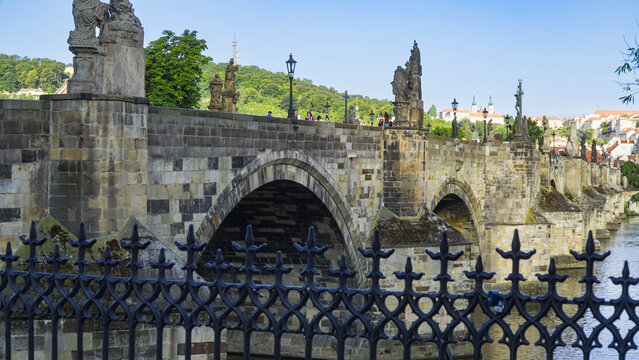 The Charles Bridge is a medieval stone arch bridge that crosses the Vltava River in Prague. It is one of the most iconic landmarks in the city.