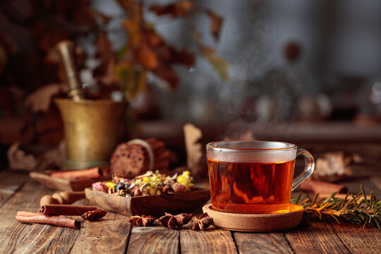 Herbal tea with cinnamon, anise, and dried herbs.