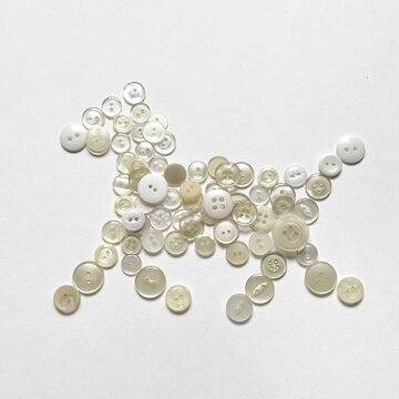 horse-shaped object made from button collage, pony made with buttons, small horse button art, dog-shaped object, decorative illustration made with white buttons