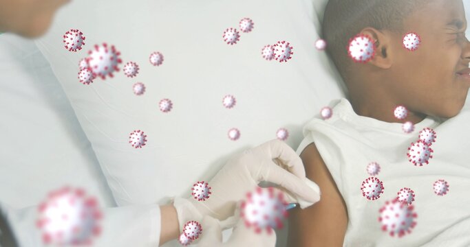 Giving doctor injecting child in tank-top at bed syringe white-coat gloves virus icons, copy space