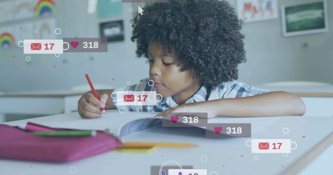 Writing student in plaid shirt at school desk, holding red pencil in workbook with overlay icons