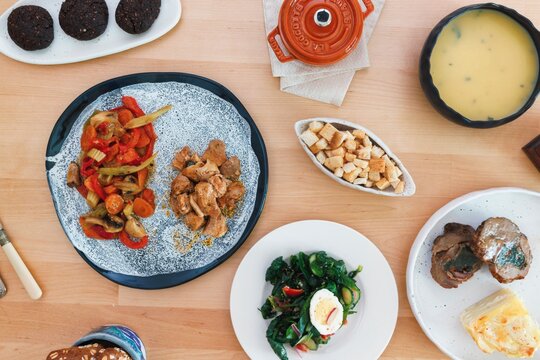 Diverse selection of meal options showcasing various food items that address food crises and highlight acute food insecurity, featuring vegetables, proteins, and grains in a well-arranged manner