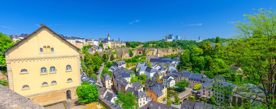 Luxembourg panorama, aerial panoramic view Luxembourg City historic centre cityscape, Luxembourg old town Grund, Ville Haute districts in Alzette river valley, old colorful buildings and green trees
