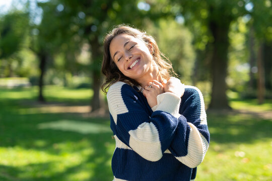Woman embracing self-love and joy in nature