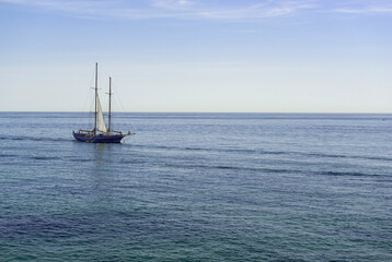 A sailing ship at sea © zheltobriukh