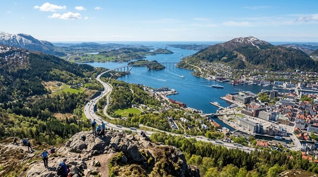 Panoramic aerial view of a vibrant coastal city nestled by fjords mountains and a bridge under a clear blue sky