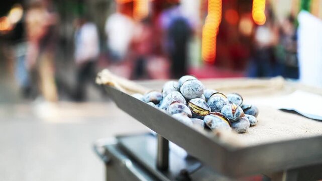 Roasted chestnuts selling on a street food stall