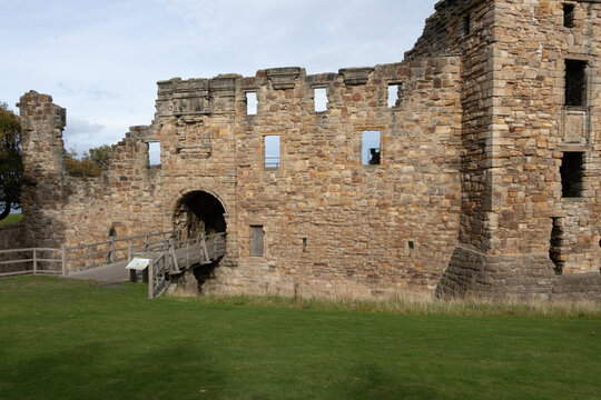 Historic stone ruins and entrance bridge of St Andrews Castle in Fife, Scotland
