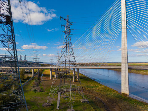 Deeside, Wales, United Kingdom - 11 October 2026: Aerial view of the Flintshire Bridge and electricity transmission towers spanning the river in Deeside, Wales, United Kingdom.