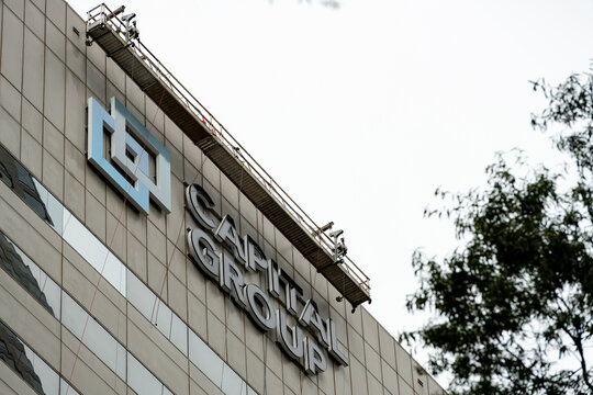 Capital Group East Coast hub in Charlotte, NC installs signage on One Independence Center in uptown Charlotte, NC