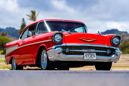 Honolulu, Hawaii, USA, 09 August 2025: Red 1957 Chevrolet Bel Air at a Sandy Beach car meet.