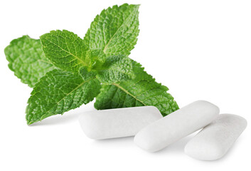 Menthol chewing gum pieces and green mint leaves isolated on white © New Africa