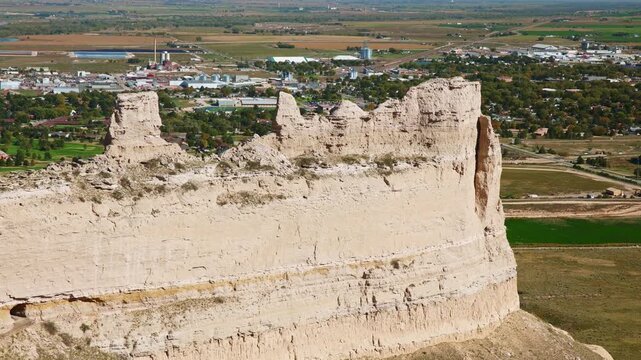 Scenic view of towering geological rock bluff rising above prairie landscape at Scotts Bluff National Monument near Gering, Nebraska