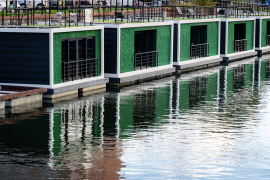 River hotel in Gdansk. Wooden cabins floating on the water surface
