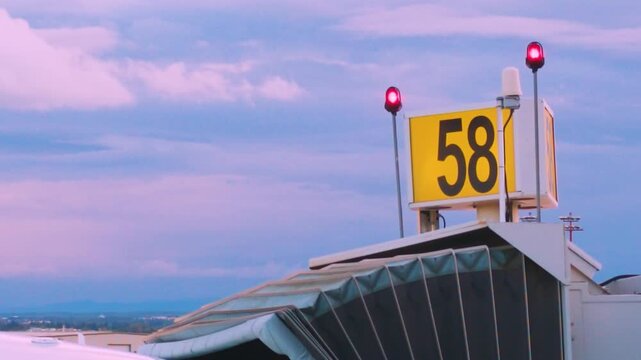 Calgary, AB, Canada - Oct 14, 2026: Airport departure gate with red warning lights at Calgary International Airport