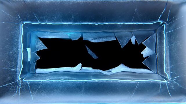 Rectangular ice block rests in a blue freezer compartment with frosted edges