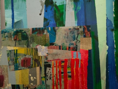 A collage of yellow striped paper, linen patches and red torn strips sits beneath vertical blue, green and mint brushstrokes. Grey paint splatters add a loose, gestural accent.