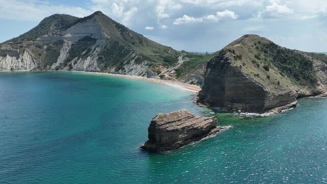 Aerial view of El Morro de Montecristi with turquoise waters and rocky cliffs along the coastline in Monte Cristi, Monte Cristi Province, Dominican Republic.
