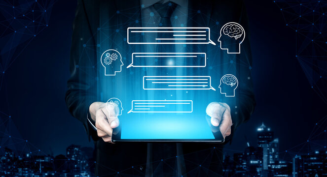 Businessman Holding Tablet with Virtual Chat Icons Representing Communication and Ideas in a Modern Urban Setting at Night. Entropy.