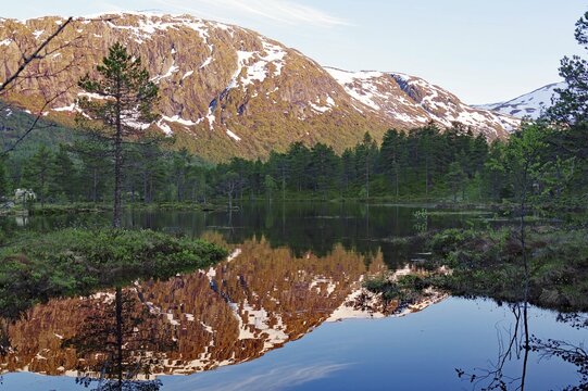 Mountains reflected in a mountain lake, spring, Gaulartal, Hov, Fossestien, norway