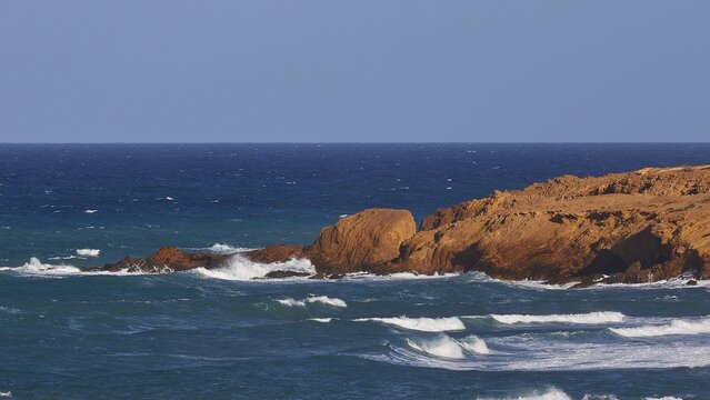 Wild sea with waves crashing against a rocky coast, West Coast, Karpathos, Dodecanese, Greek Islands, Greece