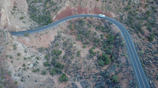 Top down aerial of hairpin bend on winding mountain road
