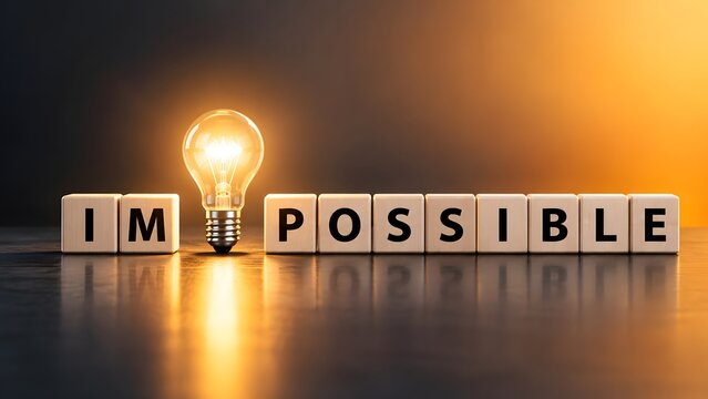 Motivational concept with a bright light bulb turning the word impossible into I'm possible on wooden cubes, symbolizing inspiration, business success, and innovative problem-solving ideas.