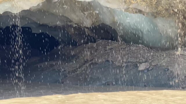 Meltwater and rockfall at a glacier cave, underground glacier stream, Castner Glacier, Delta Range, Alaska Range, Richardson Highway, Alaska, USA