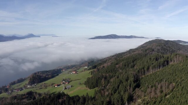 Drone flight over farmhouses in the morning fog, autumn, forest, agricultural landscape, Mondsee, Mondseeland, Salzkammergut, Upper Austria, Austria