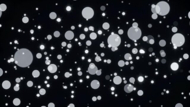 Dynamic sparkling illuminated circles drift gracefully through dark expanse