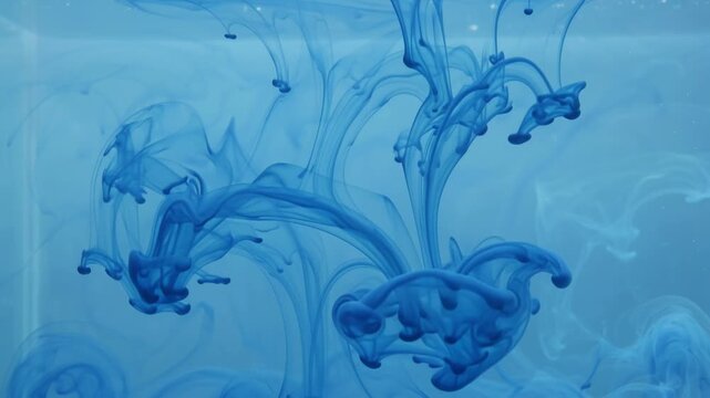 Blue Ink Drops in Water Abstract Background for Design