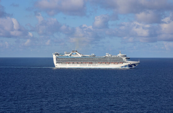 Bahamas on April 28, 2026. The Princess Cruises luxury liner, Caribbean Princess, navigates the turquoise waters of the Atlantic Ocean near the Bahamas.