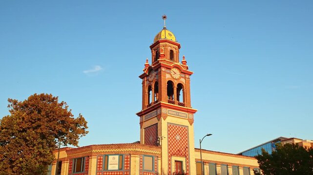 Spanish Revival Giralda tower replica glowing in early morning light at Country Club Plaza in Kansas City Jackson County Missouri