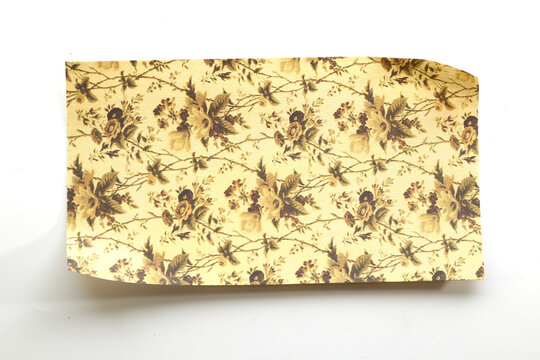 Vintage beige paper with delicate brown botanical motifs for elegant scrapbook and stationery designs.