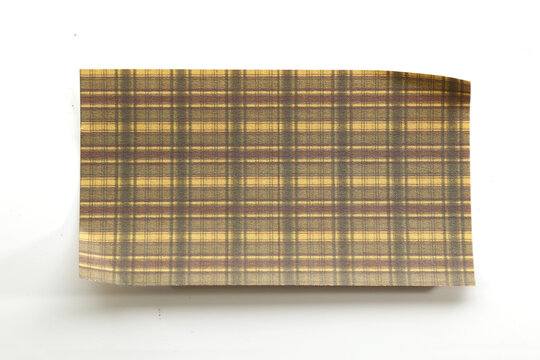 Brown and beige plaid paper with a classic checkered pattern for rustic stationery and craft projects.