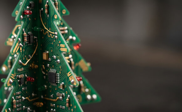 Electronic Christmas tree made from printed circuit boards with electronic components for technology holiday celebration concept
