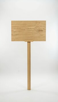 Blank wooden signpost with a rectangular board isolated on white background
