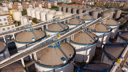 Aerial view of large white industrial grain storage silos © Zhaorui