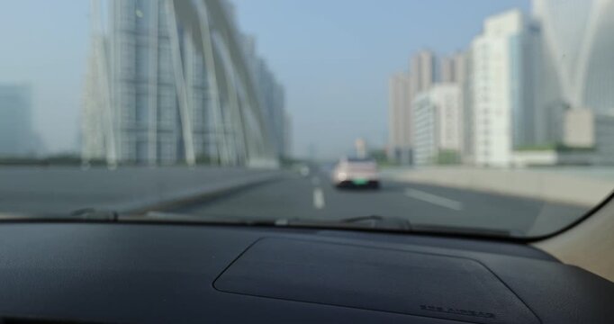 People driving car on the modern city road