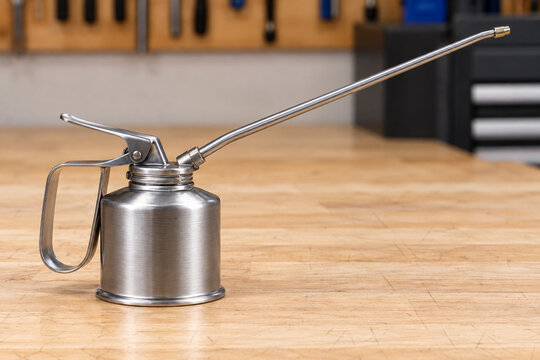 Metal Oil Can with a Long Spout on a Workshop Bench