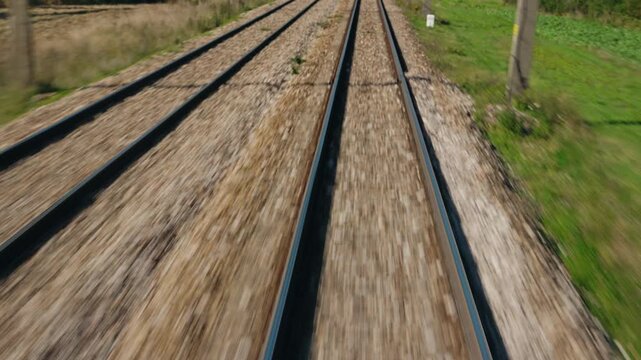 Forward Motion Along Parallel Railway Tracks Through Rural Countryside