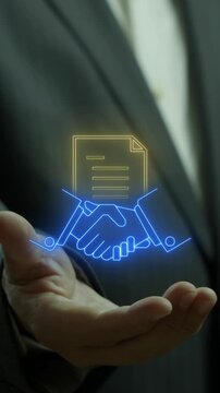 Businessman open hands presenting glowing partnership handshake and contract document icons vertical shot. Corporate agreement collaboration, legal commercial deal, and enterprise system concept.
