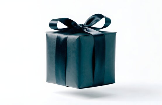 Black gift box with satin ribbon floating against white background