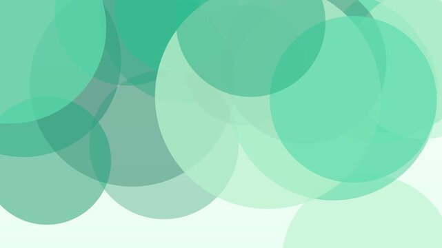 ミントとエメラルドの半透明の丸が重なり画面全体を個別に漂うループ動画。Web広告や配信背景に映える円形模様のシネマティック素材