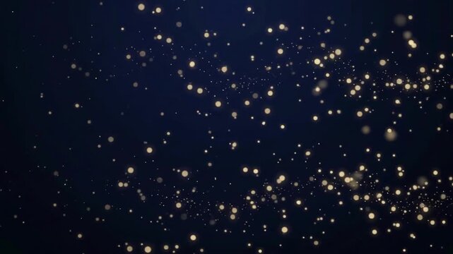 Abstract dark blue background with floating golden dust particles and light bokeh effect