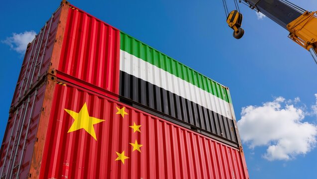 Low angle view of UAE and Chinese flag cargo containers under crane, trade, export