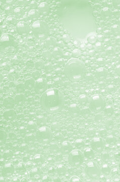 Bubbles of body gel or shampoo or shaving gel. Closeup.