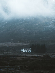 View of the Lagangarbh Hut nestled at the base of the misty Buachaille Etive Mor mountain in the Scottish Highlands, Altnafeadh, Scotland, United Kingdom. © Travel 'n' Lifestyle