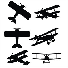 Set of black silhouette biplane icons in various perspectives and flight angles isolated on white background © shahriar
